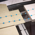 CLOVER 20 MOTIFS TURQUOISE GOLD NECKLACE